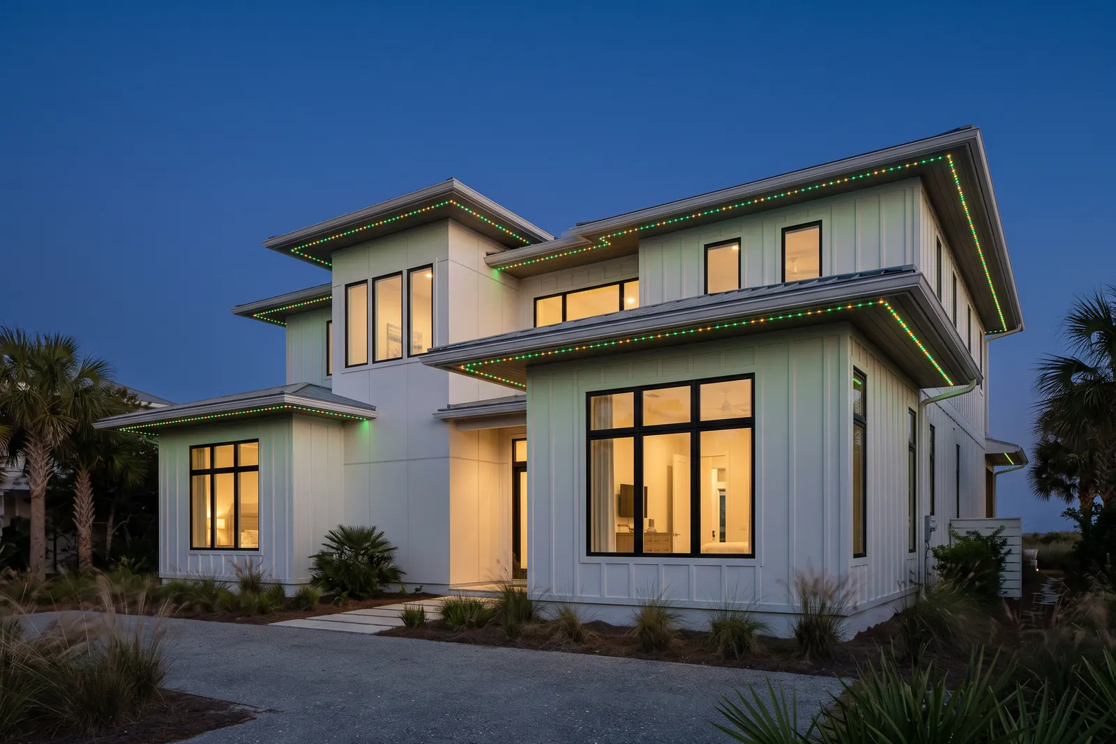 Modern coastal home with alternating emerald and gold permanent eave lights, design concept